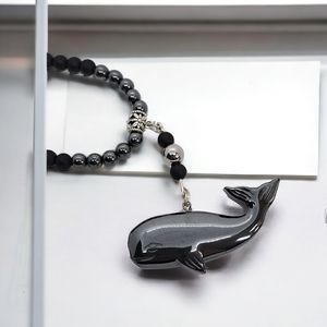 Black whale beaded pendant necklace